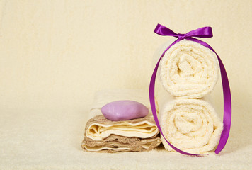 Set of the towels and soap on a terry cloth