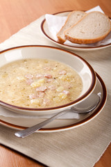 Potato soup with sausage and bread