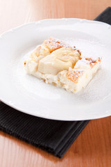 Cheesecake souffle with almonds sprinkled with sugar