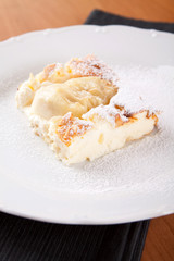 Cheesecake souffle with almonds sprinkled with sugar