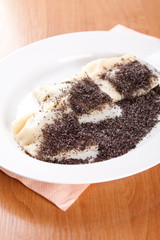 Poppy bags full of fruit and sprinkled with poppy seeds