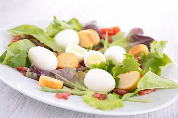 salad with egg, crouton and bacon