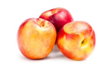 Fototapeta na wymiar Close up of three peaches, isolated