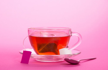 Cup with tea bag on saucer