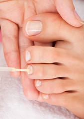 Beautician Applying Nail Varnish