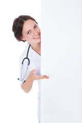 Female Doctor Behind Placard