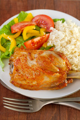 baked pork with boiled rice and salad