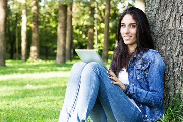 Smiling young female with digital tablet