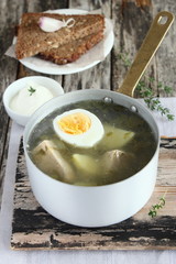 Traditional russian sorrel soup with meat and egg.