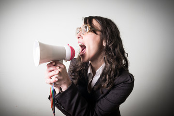 beautiful young businesswoman with little megaphone