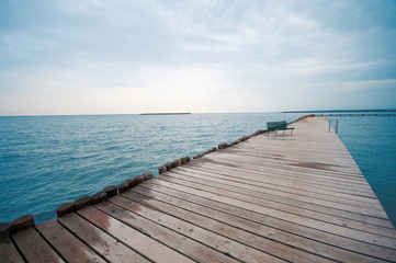Fototapeta premium bench on a wooden bridge on the lake