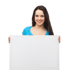 smiling young girl with blank white board