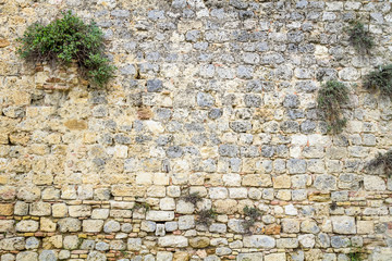 Medieval wall built of ancient stone
