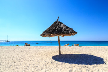 Umbrella on a white sand beach