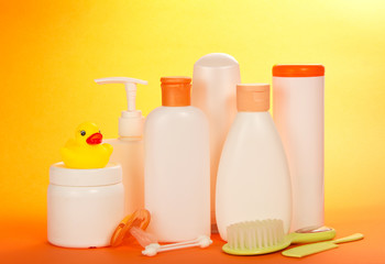 Baby cosmetics, hairbrush and cotton stick