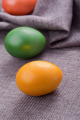 dyed easter eggs lying on a blanket