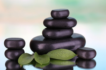 Spa stones on bright background