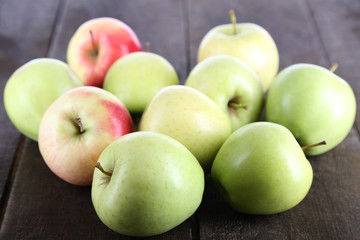 Juicy apples on wooden table