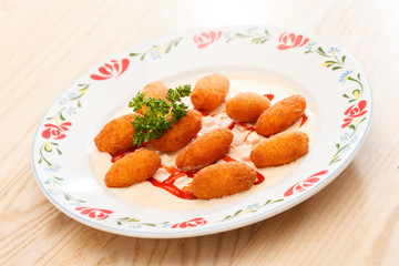 potato balls with sauce
