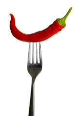 Fototapeta na wymiar Red hot chili pepper on fork, isolated on white