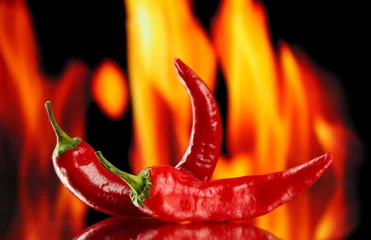 Zelfklevend Fotobehang Red hot chili peppers op brand achtergrond © Africa Studio