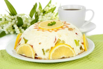 Delicious jelly cake on table on white background