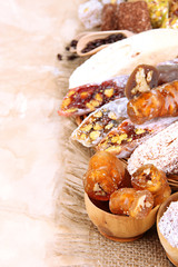 Tasty oriental sweets, on brown background