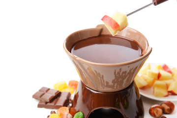Chocolate fondue with fruits, isolated on white