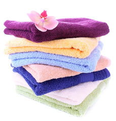 Orchid flower and towels, isolated on white