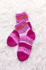 Woolen socks, on color background