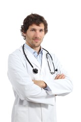 Fototapeta premium Attractive young doctor man posing with folded arms