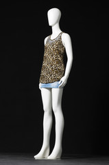 full-length female mannequin dressed in shirt and short