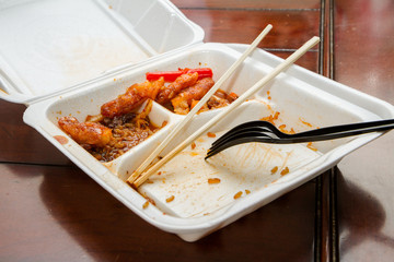 Chinese food in a takeout box