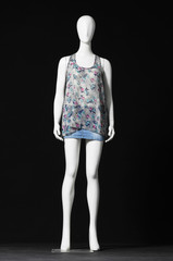 full-length mannequin in elegant shirt and jeans shorts