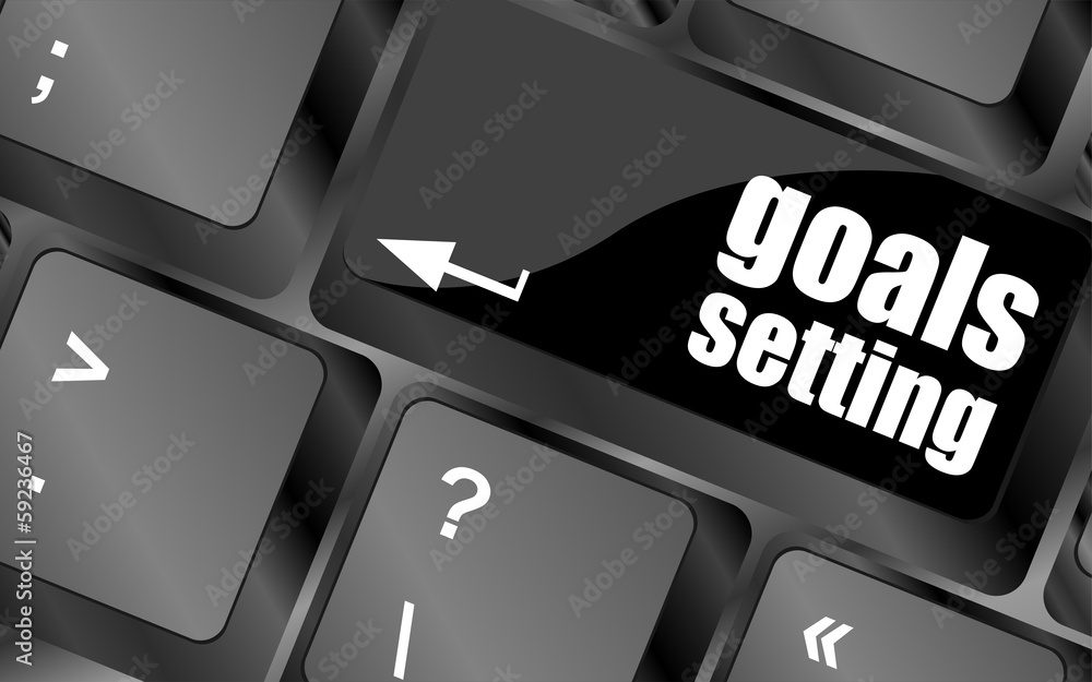 Poster goals setting button on keyboard with soft focus