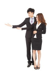 Young smiling businesswoman and businessman with showing gesture
