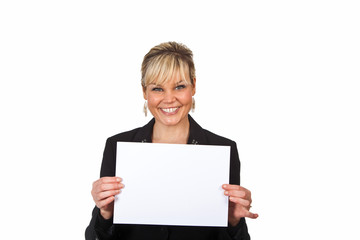 Studio portrait of a cute blond girl holding a piece of paper