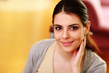 Closeup portrait of a young beautiful woman at home