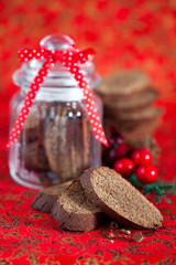 Chocolate coffee biscotti in glass jar, selective focus