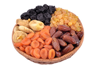 Various dried fruits in wicker bowl