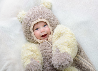 cute funny infant boy like a bear, beautiful kid's portrait