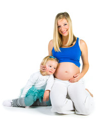 Pregnant woman with 2 zo daughter on white