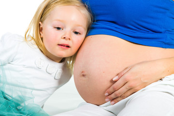 Pregnant woman with 2 zo daughter on white