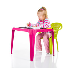 Child drawing with crayons isolated on white