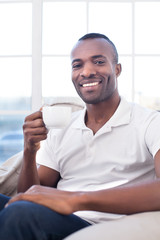 Man drinking coffee.