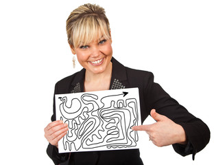 Studio portrait of a cute blond girl holding a piece of paper