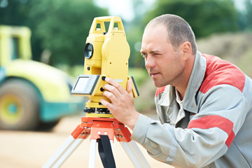 surveyor works with theodolite
