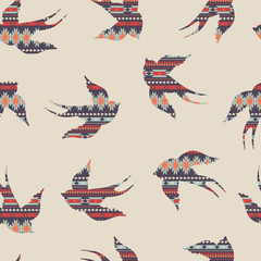 Vector seamless colorful decorative ethnic pattern with swallows