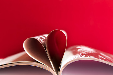 Pages of a book curved into a heart shape