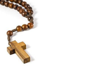 wood rosary with cross at left border